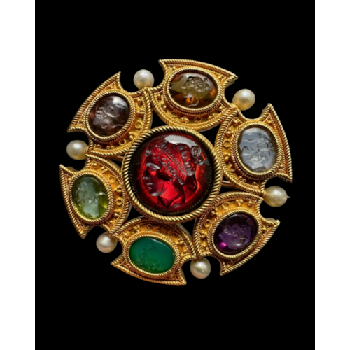 Attributed to Robert Phillips. An Etruscan Revival gold brooch with intaglios and pearls.
